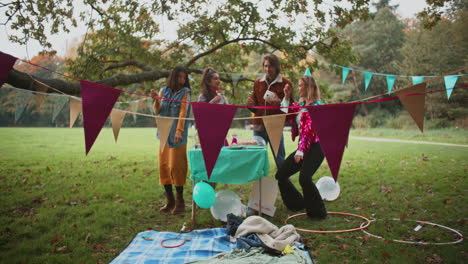 friends celebrating birthday in a park