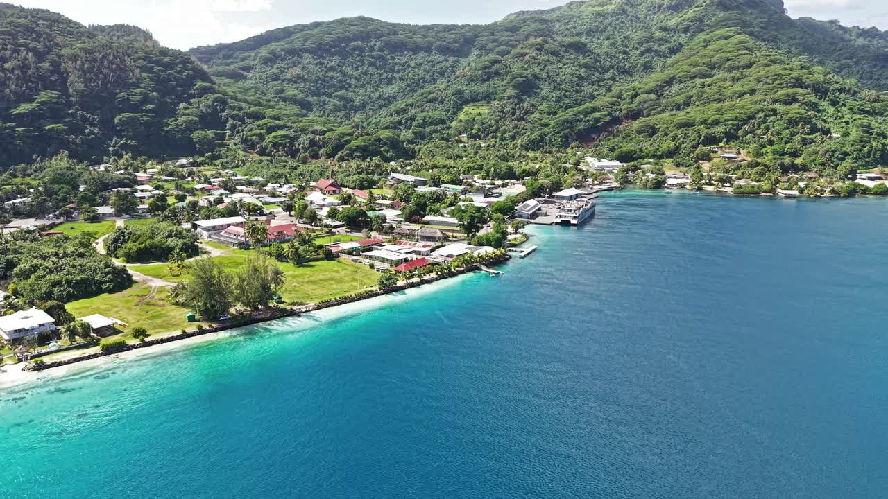 French Polynesia, Huahine island. Aerial View of Fare Village, Port Buildings and Turquoise Lagoon Water
