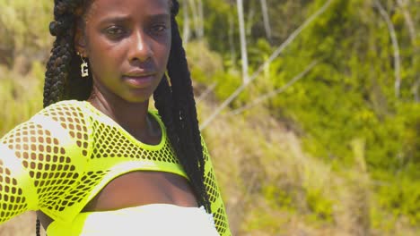 lovely smile of this african girl with long braided hair on the caribbean island of trinidad