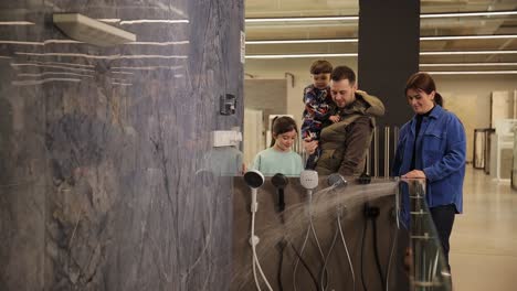 family shopping for bathroom shower heads