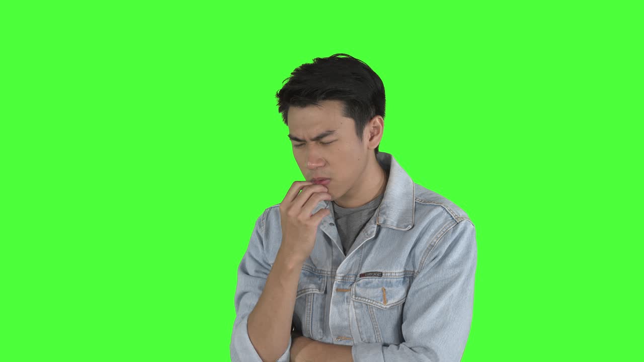 Young man pondering something in the studio