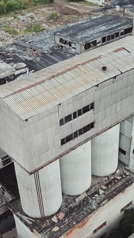 abandoned industrial building. ruins of an old factory. aerial view. vertical video