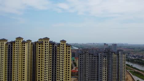 cinematic aerial establishing shot of empty tall skyscrapers in china, nanhai new district