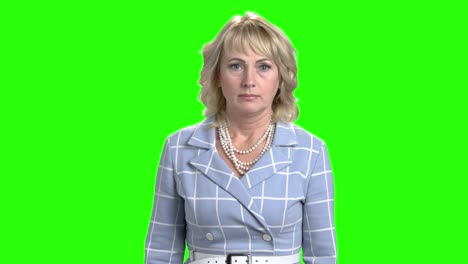 confident business woman on green screen.