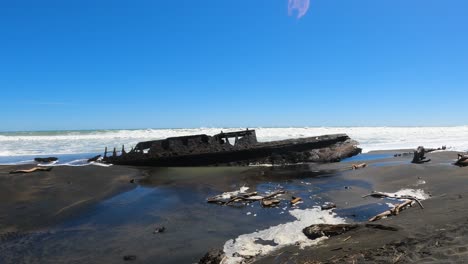 shipwreck ss waitangi on patea beach in new zealand - wide shot