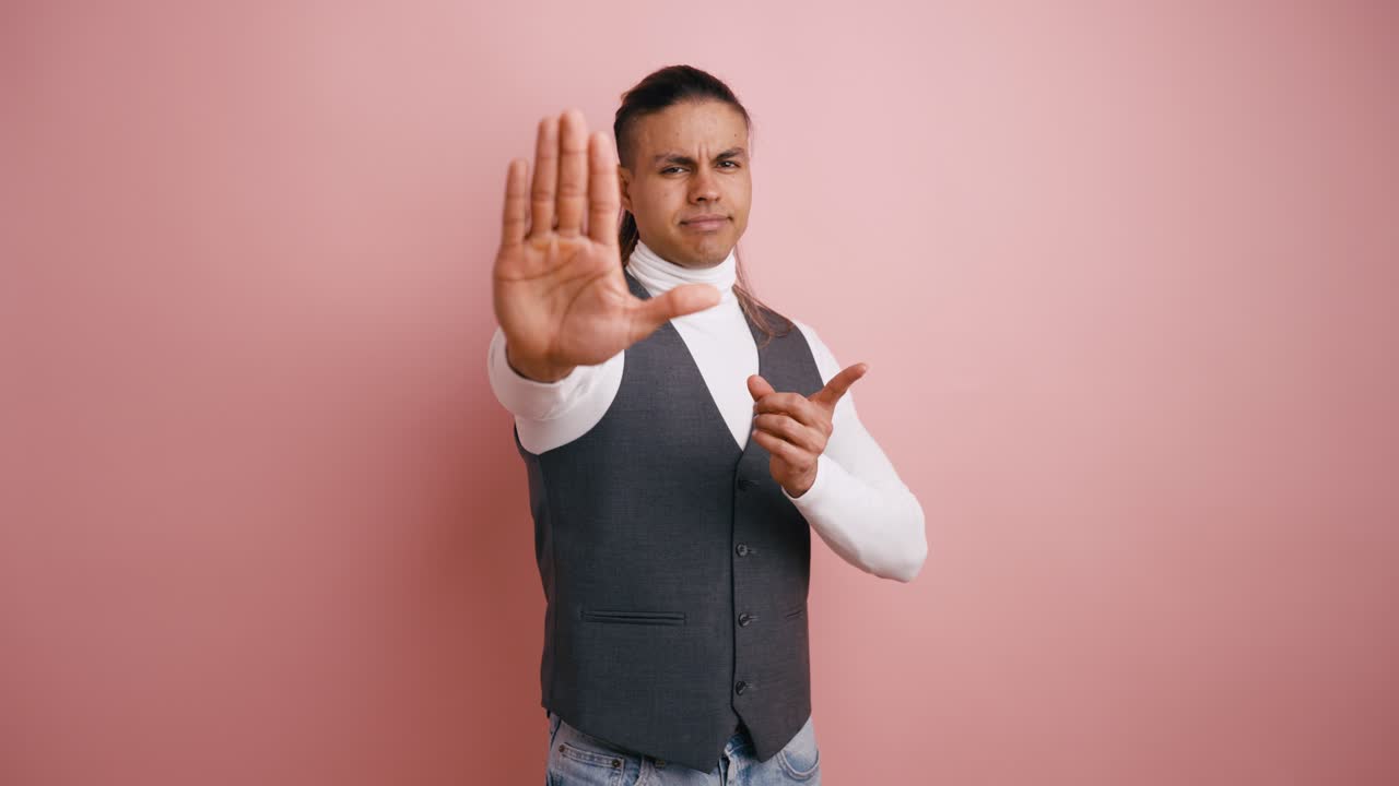 Man Making Stop Gesture and Warning with Finger