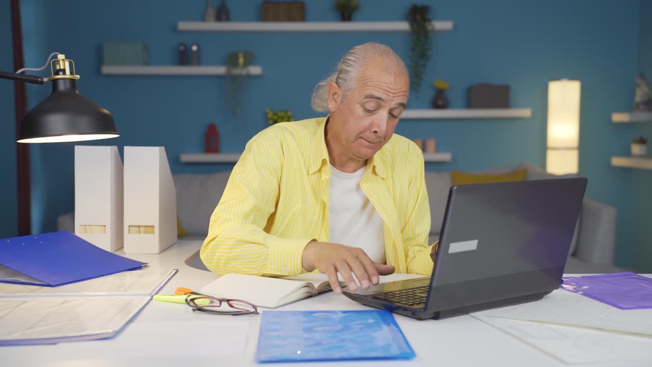 Home office worker old man stressed and thoughtful.