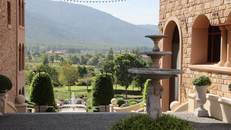 panoramic view of lush gardens and distant mountains