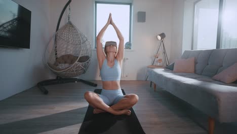 woman practicing vr yoga at home