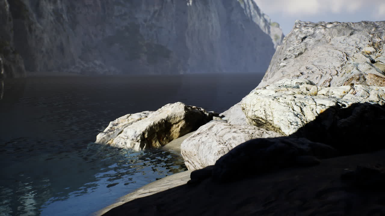 Rocky shoreline along a tranquil waterway in australia at midday