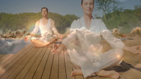 animation of clouds over caucasian couple practicing yoga and meditating