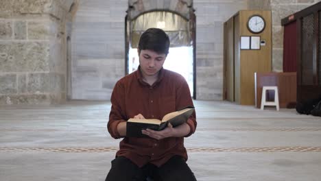 man reading quran