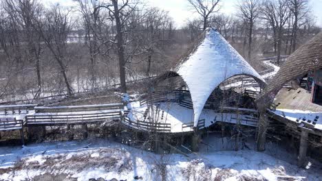 derelict majestic buildings of old zoo in michigan, aerial pan view