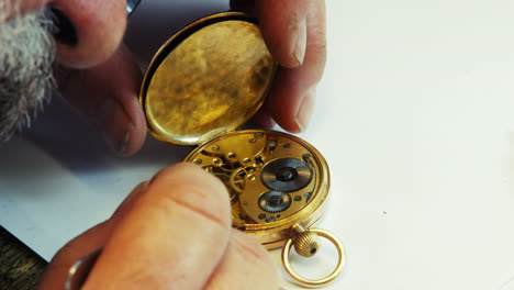 Horologist-repairing-a-pocket-watch