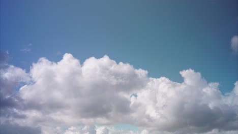 puffy clouds move across summer sky no horizon, time lapse