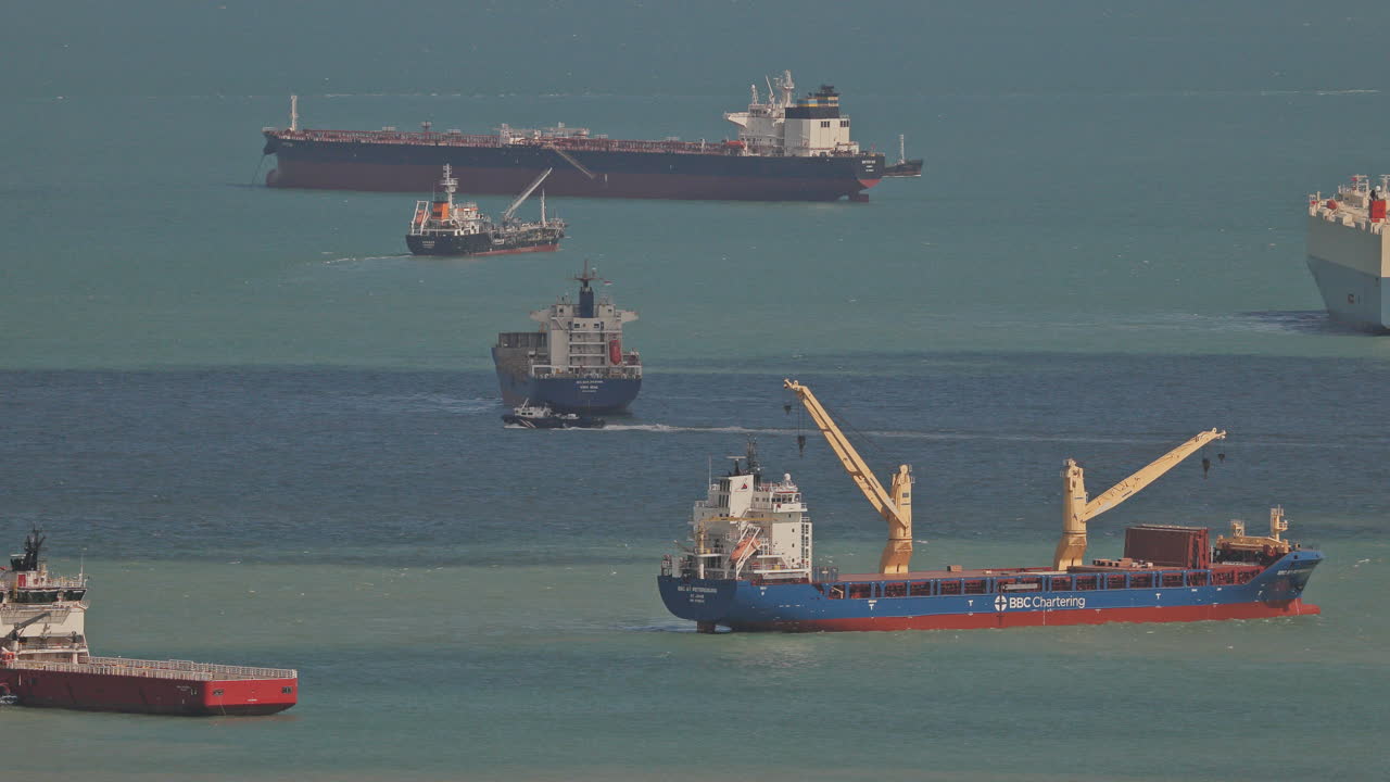 SINGAPORE - 5 MARCH 2025 : container ships waiting in the sea by singapore