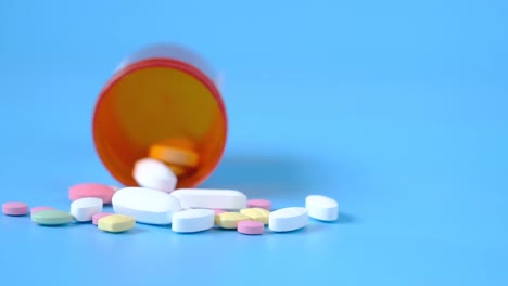 assorted pills in orange bottle