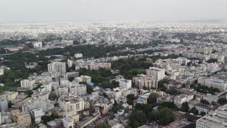 Aerial footage shows crowded mid-size apartments and Railway Station Train leaving in a city in India, the commercial area around Star hotels, and one of the city&#039;s wealthiest neighbourhoods