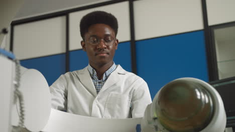 young african american medical student in lab setting