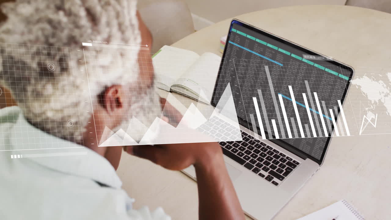 Animation of data processing over african american businessman using laptop