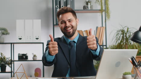 Happy-business-man-looking-approvingly-at-camera-showing-thumbs-up,-like-positive-sign,-good-news