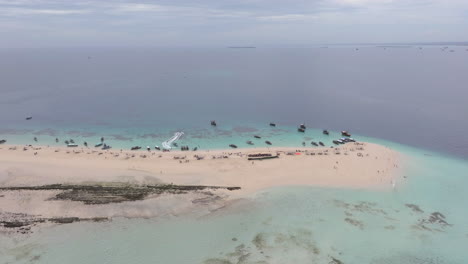 Aerial-view-of-beautiful-Nakupenda-island-with-white-sand-beach,-boats-and-tourists,-Zanzibar,-Tanzania