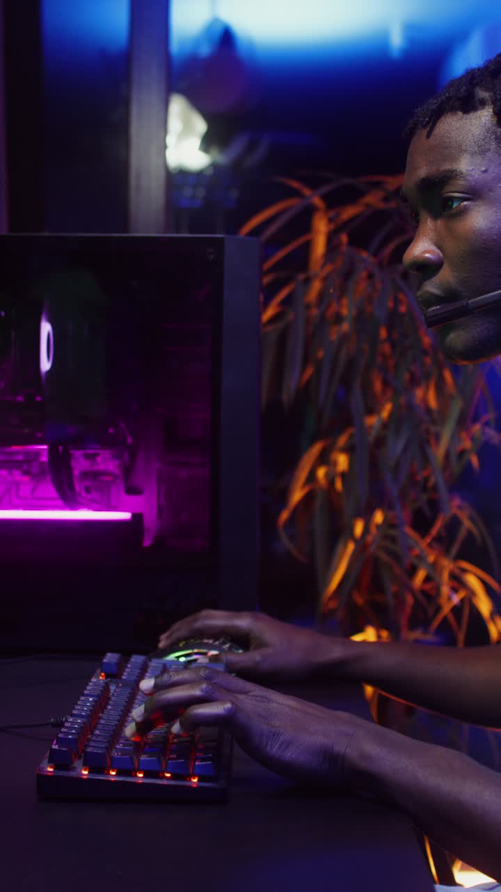A gamer playing video games on a high-end PC