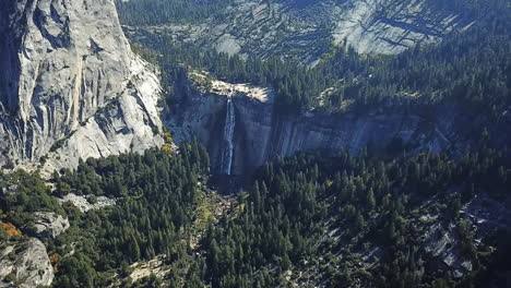 water flowing from waterfall into beautiful valley at yosemite national park, usa