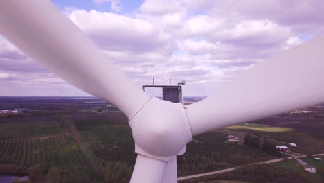 aerial view of wind turbine spinning creating renewable energy