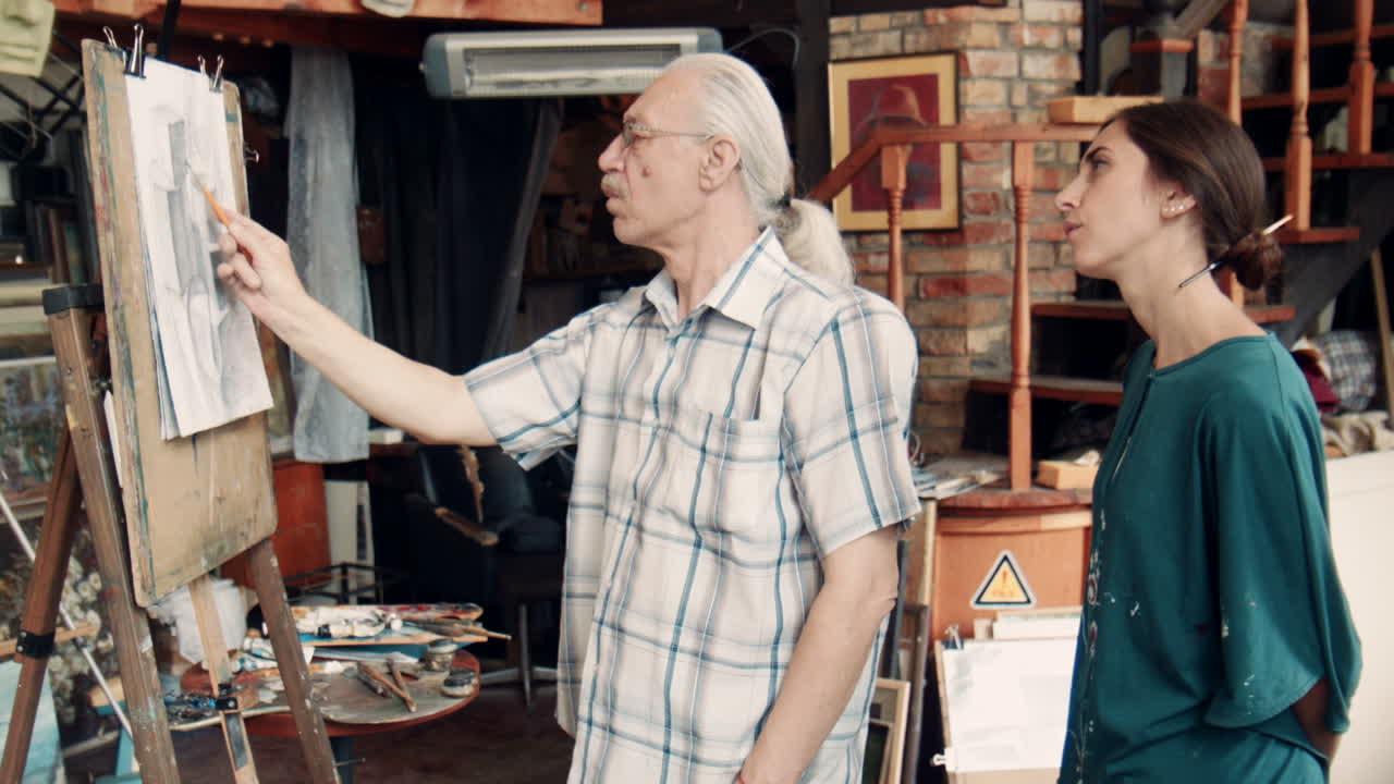 Art Class:  Teacher Guiding Student in Drawing