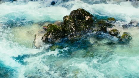immerse yourself in the pristine beauty of the julian alps with this stunning capture of a mountain river near kranjska gora, slovenia. crystal-clear turquoise water flows over smooth river rocks.