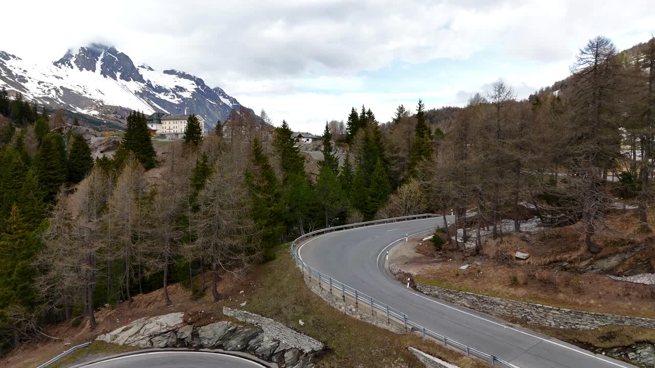 Aerial View of a Winding Mountain Road in the Alps