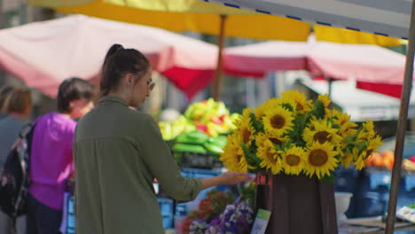 woman shopping at an outdoor market