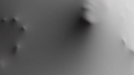 a creepy silhouette of a woman's face appears screaming from the white surface