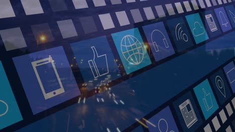 animación de múltiples iconos digitales contra la vista aérea del tráfico de la ciudad noche de arte