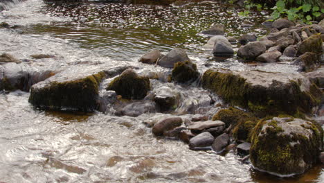 water going around stones on the river wharfe at cray, buckden wood lane, b6160 in the yorkshire dales