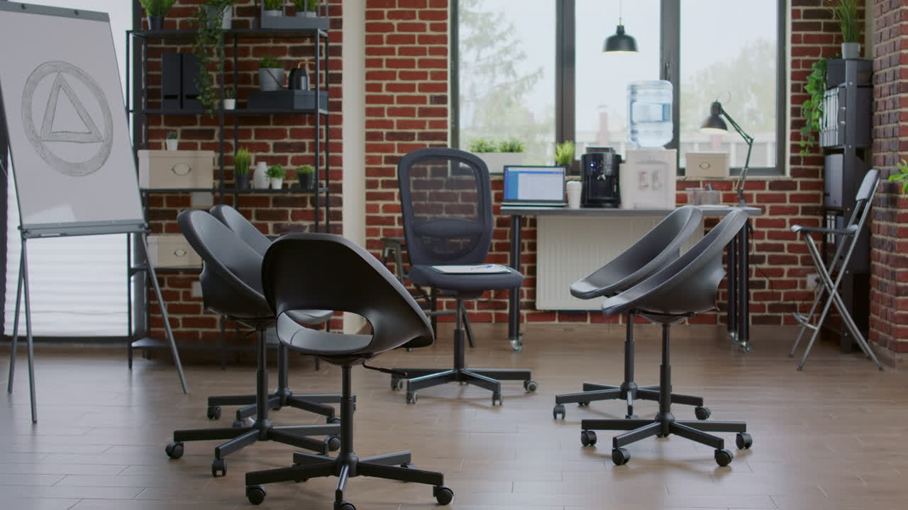 Nobody in empty space decorated with chairs in circle for aa meeting and group therapy