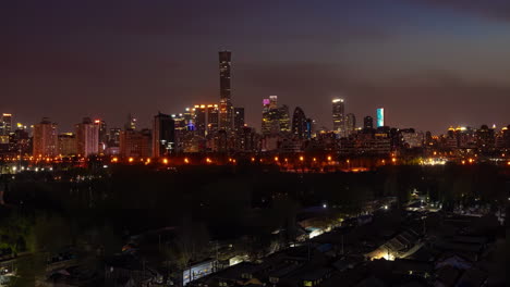 Avenue-City-highway-crossroad-traffic-flow-landscape-night-scene-near-small-lake-river,-Time-Lapse-Heavy-traffics-jam-cars-flowing-at-Dusk