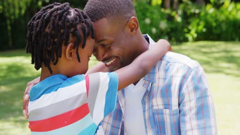 man hugging his son