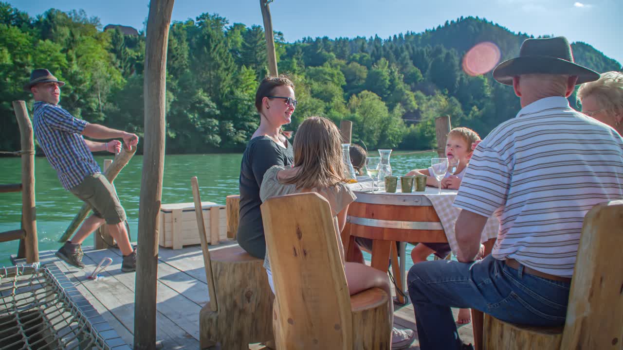 Family spending quality time on a log raft at Muta Slovenia