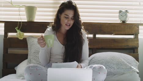 a woman looking at a document while talking