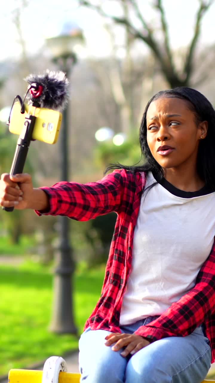 Woman Vlogging in the Park