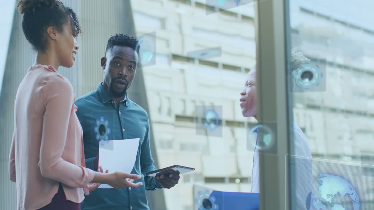 Animation of icons and data processing over diverse business people in office