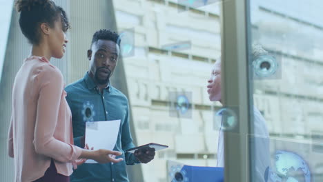 animation of icons and data processing over diverse business people in office