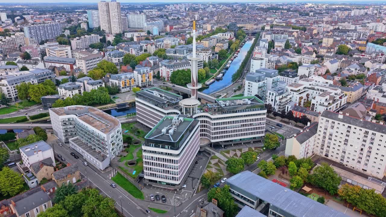Aerial drone view of Le Mabilay building, Vilaine river and Tours des horizons in Rennes, France, city with modern architecture