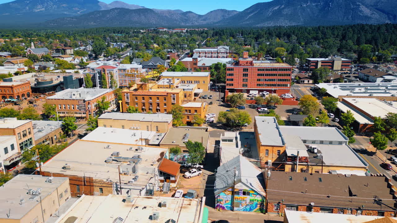 Flagstaff, USA, 24 August 2025: Scenery of a lovely town with lots of greenery. Mountain range at backdrop. Flagstaff, Arizona, USA