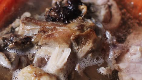 cooking meat soup in a pot