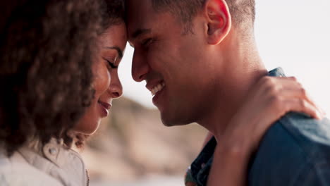 couple, forehead touch and hug on beach with love