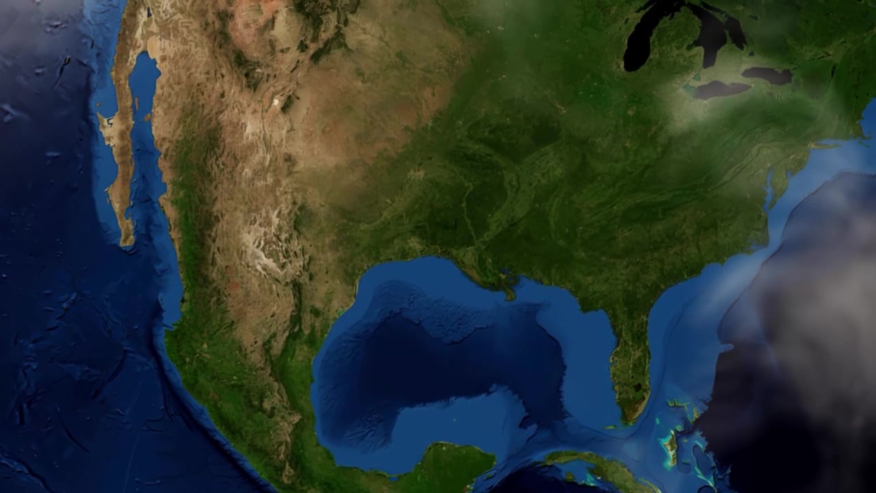 A vista de satélite amplia do espaço sideral diretamente para Beaumont, no Texas, com um alfinete de localização. Inclui imagens de domínio público da NASA