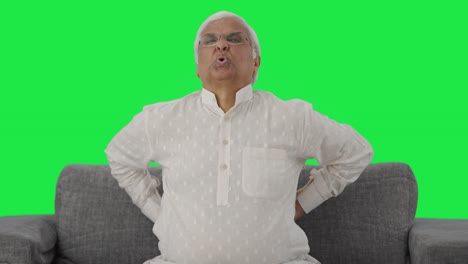 Sick-Indian-old-man-suffering-from-back-pain-Green-screen